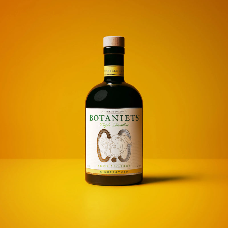 Botaniets Ginger-Yuzu, taste it to believe it! Bottle of alcohol-free spirit on a vibrant yellow background.