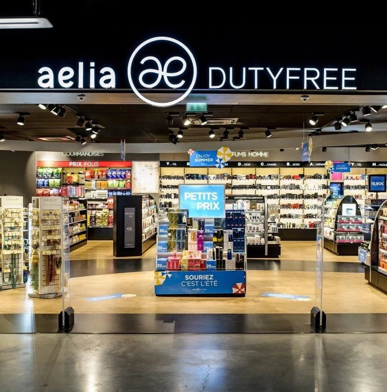 New partnership with Aelia Duty Free displayed at the Aelia Duty Free store entrance.